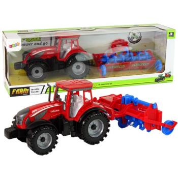 Piros traktor súrlódó meghajtású ekével kép
